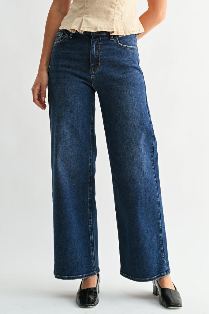 vintage-inspired high rise straight leg jeans in a dark blue denim wash 