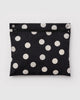 cloud carry-on bag in black and cream polka dot