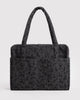 carry-on bag in a charcoal ditsy floral pattern