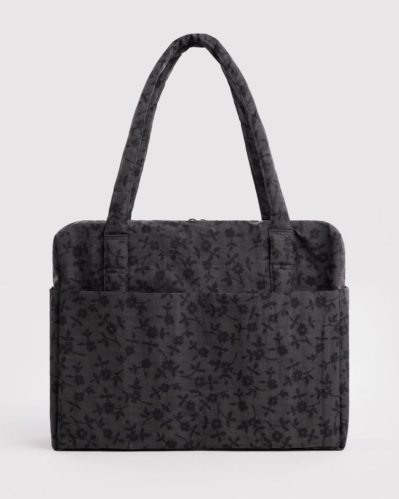 carry-on bag in a charcoal ditsy floral pattern