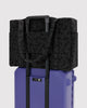 carry-on bag in a charcoal ditsy floral pattern