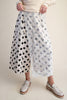 white wide leg pants with trendy black polka dots throughout
