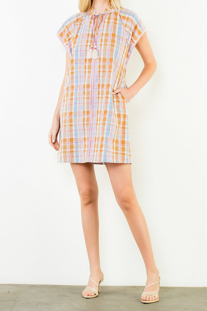shift dress in a summery plaid pattern with ruffled neckline and tie detail