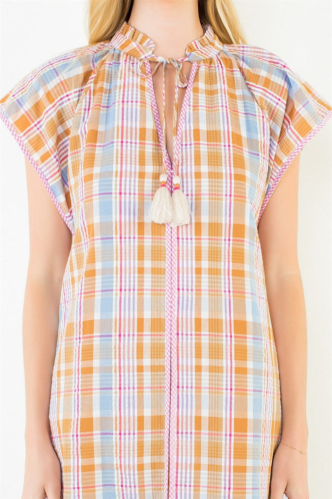 shift dress in a summery plaid pattern with ruffled neckline and tie detail