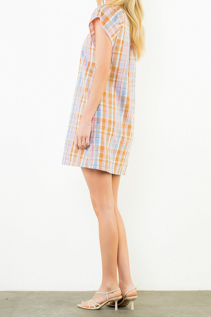 shift dress in a summery plaid pattern with ruffled neckline and tie detail