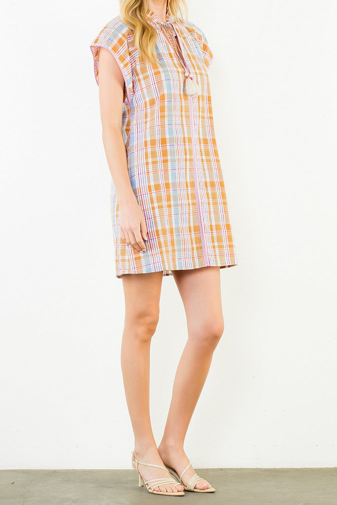 shift dress in a summery plaid pattern with ruffled neckline and tie detail