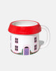 oversized three dimensional mug in the shape of a cozy cottage