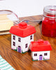 salt and pepper shaker set in the shape of two cozy cottages