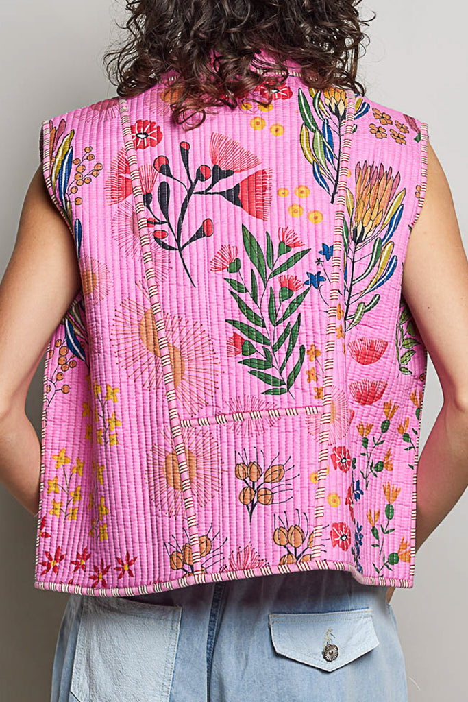 quilted vest in a pink floral pattern