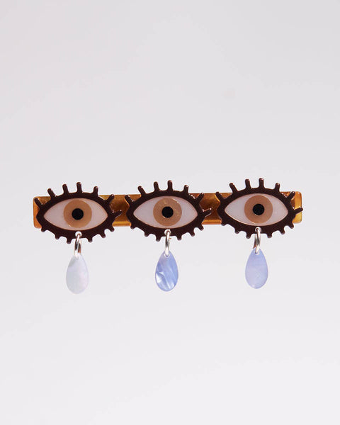 alligator clip featuring three eyes with teardrop details 