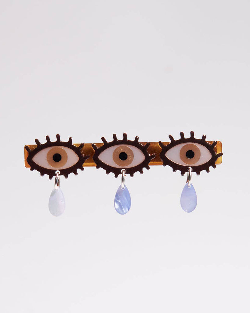 alligator clip featuring three eyes with teardrop details 
