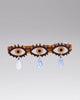 alligator clip featuring three eyes with teardrop details 