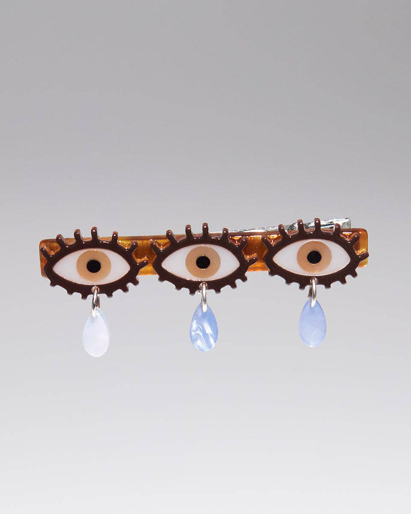 alligator clip featuring three eyes with teardrop details 
