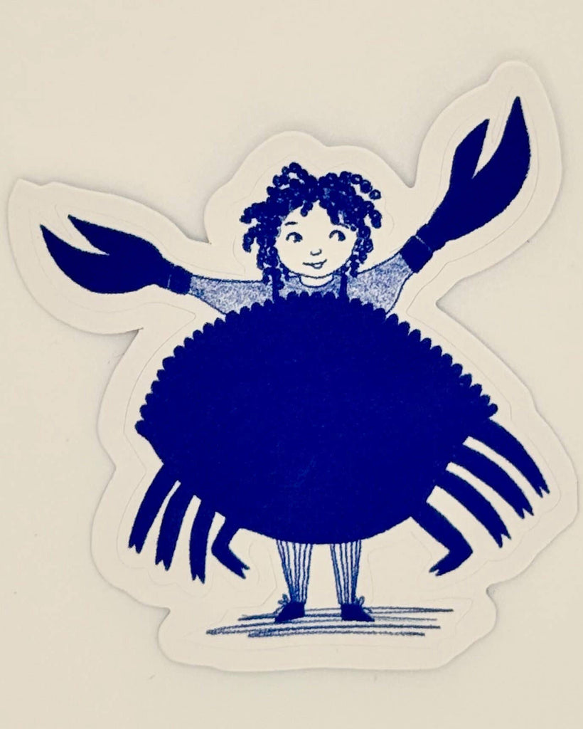 A die-cut sticker featuring a whimsical illustration of a girl with curly hair wearing a large blue crab shell dress, standing on a cream-colored background.