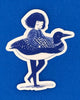 A die-cut sticker featuring a dark blue illustration of a girl in a loon costume 