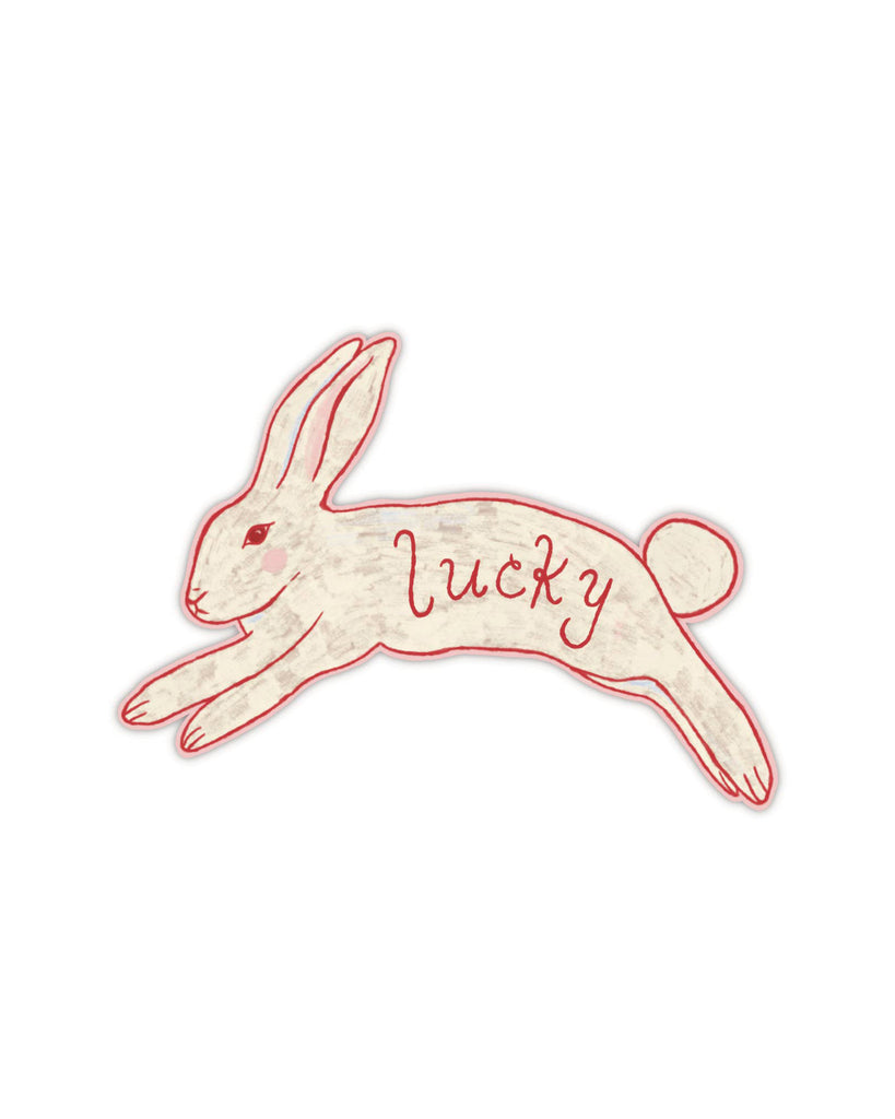 matte vinyl sticker  in the shape of a leaping bunny with the message "lucky" in red script. 