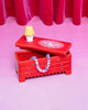 ceramic trinket box in the shape of a red dresser