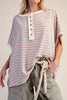 oversized cream colored top in turquoise and red stripes