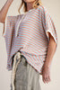 oversized cream colored top in turquoise and red stripes