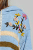 ultra soft chenille hoodie in sky blue with cream and brown stripes and special sewn floral details.