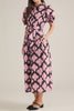 button down shirt dress in a striking black and pink abstract pattern