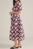 button down shirt dress in a striking black and pink abstract pattern