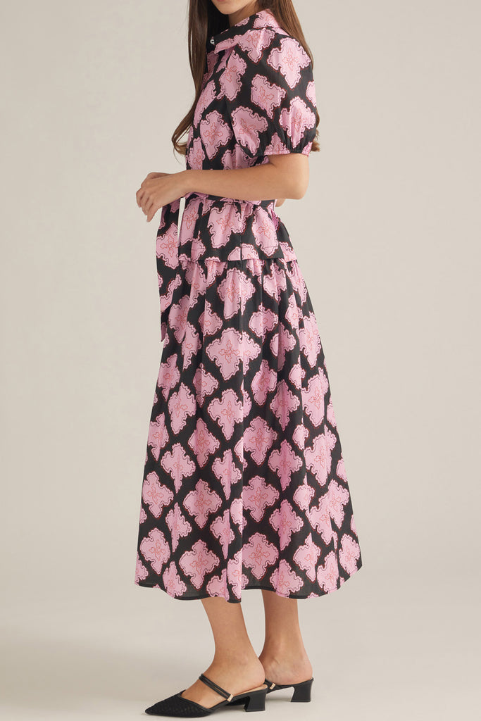 button down shirt dress in a striking black and pink abstract pattern