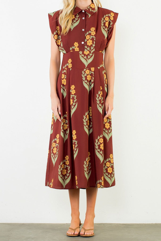 striking brick red dress with a beautiful floral design