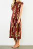 striking brick red dress with a beautiful floral design