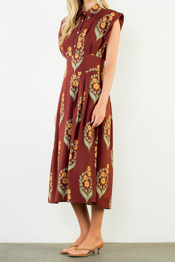 striking brick red dress with a beautiful floral design