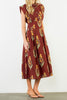 striking brick red dress with a beautiful floral design
