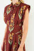 striking brick red dress with a beautiful floral design
