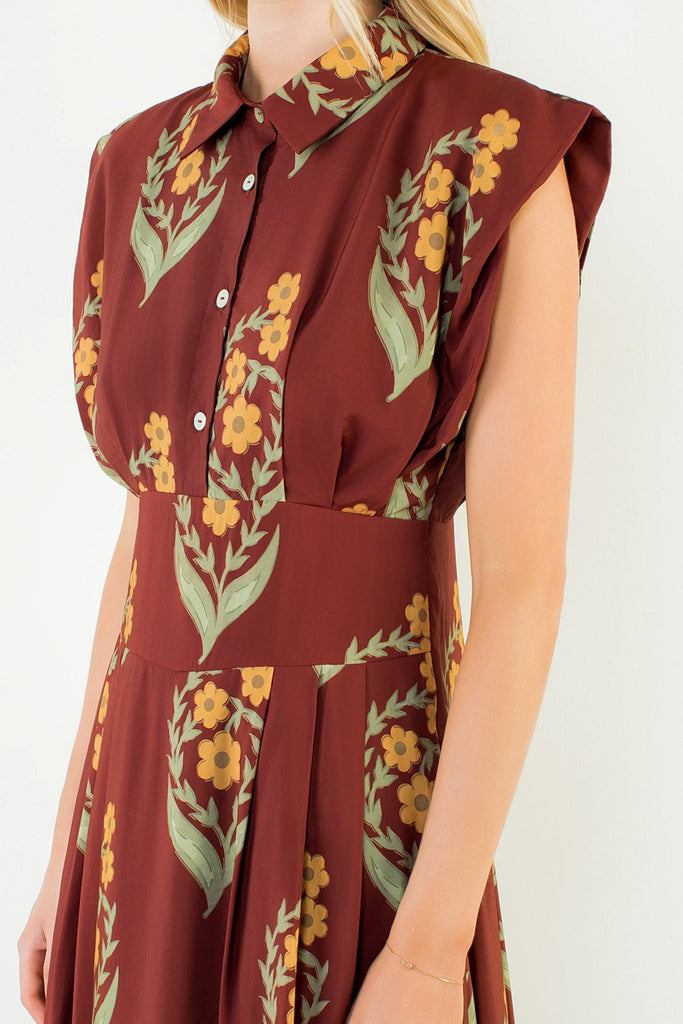 striking brick red dress with a beautiful floral design