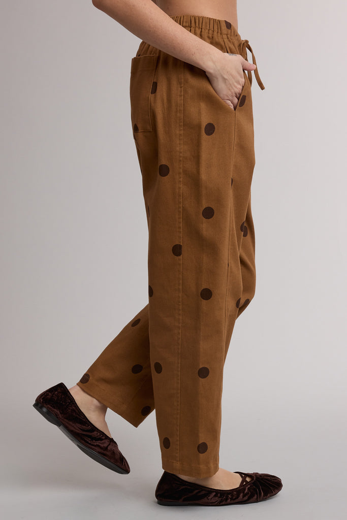 camel pull-on trousers with chocolate brown polka dots throughout