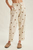 off white trousers with cute polka dots in deep ochre