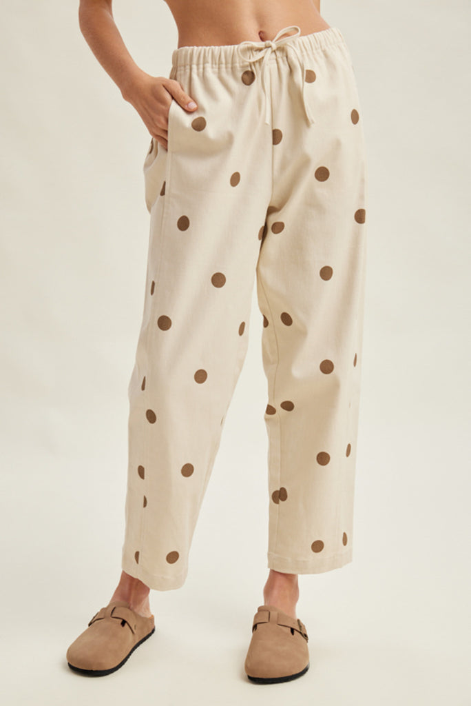 off white trousers with cute polka dots in deep ochre