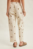 off white trousers with cute polka dots in deep ochre