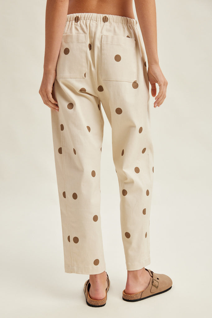 off white trousers with cute polka dots in deep ochre