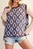 oversized knit sweater vest in chocolate brown with a sky blue argyle-inspired floral pattern 