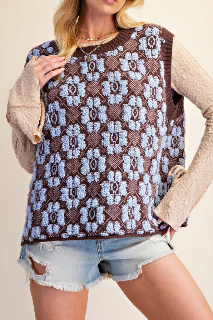 oversized knit sweater vest in chocolate brown with a sky blue argyle-inspired floral pattern 