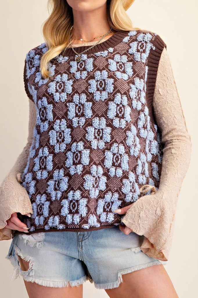 oversized knit sweater vest in chocolate brown with a sky blue argyle-inspired floral pattern 