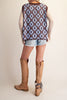 oversized knit sweater vest in chocolate brown with a sky blue argyle-inspired floral pattern 