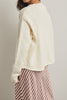 cream colored sweater with a cute knit flying duck knit graphic