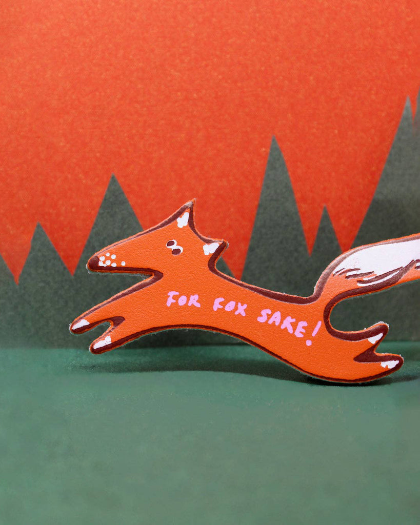 genuine leather key fob in the shape of a fox with the message "for fox sake!"