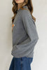 heather grey sweater with a knit fox graphic