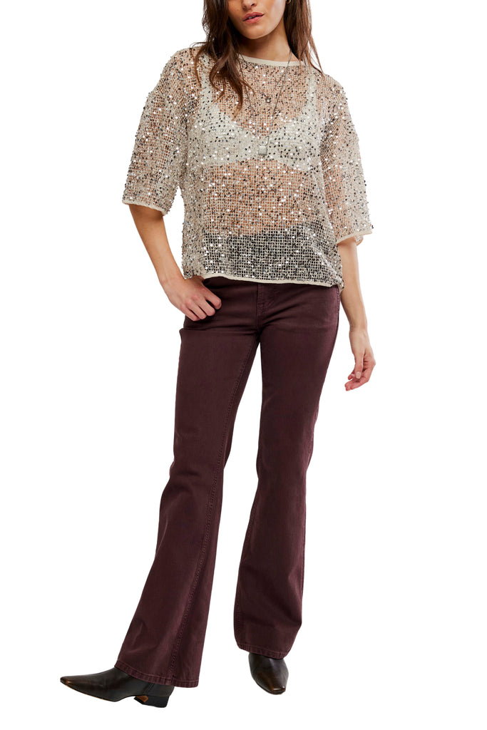 free people dazzling tee with a sequined net fabrication.