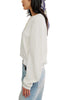 white long sleeve tee with dropped shoulders and a cropped length