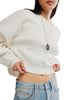 white long sleeve tee with dropped shoulders and a cropped length
