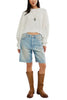 white long sleeve tee with dropped shoulders and a cropped length