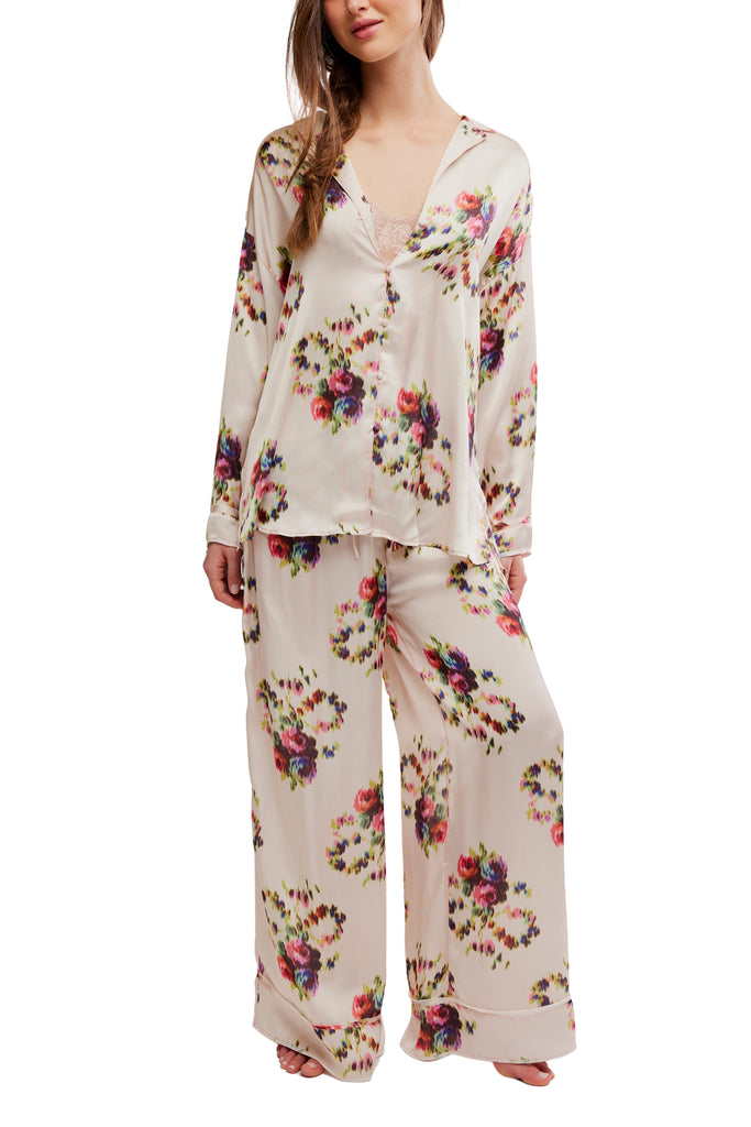 silky pajama set from free people in an ivory floral pattern